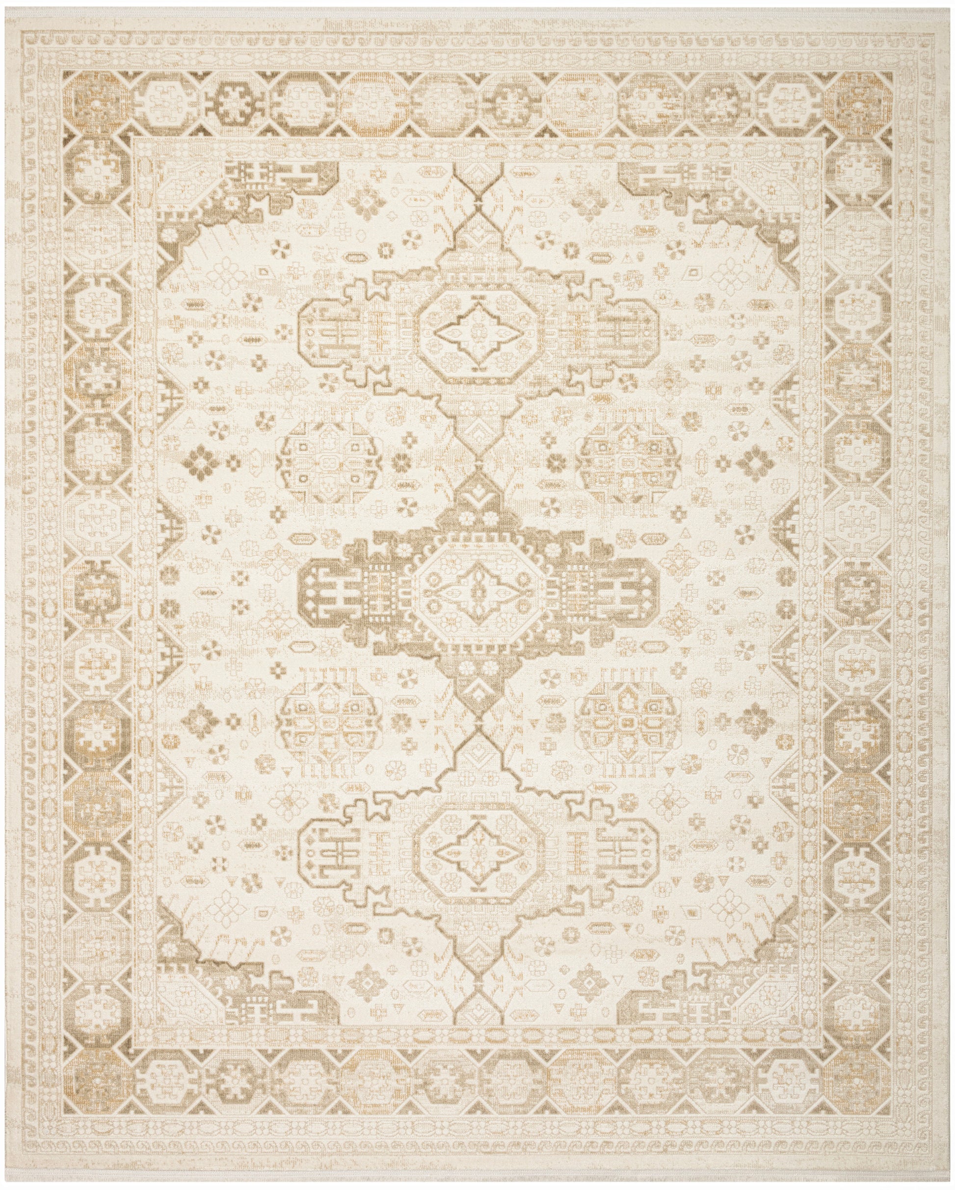 Cream and taupe Persian-style area rug with distressed geometric medallions and ornate border.