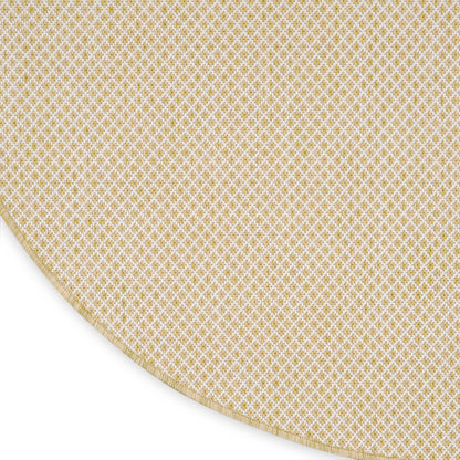 Beige round rug with a curved gold lattice border visible at the edge.