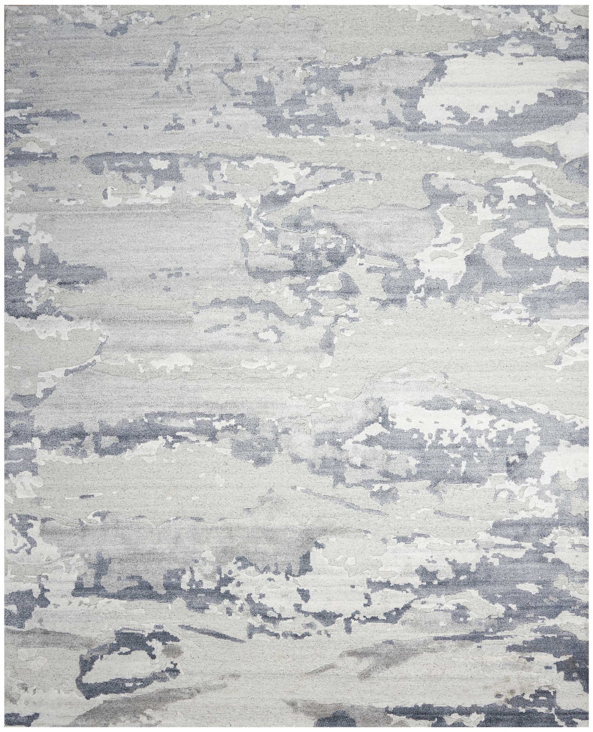 Abstract gray and ivory area rug with a weathered, brushstroke pattern; soft, low-pile contemporary decor.
