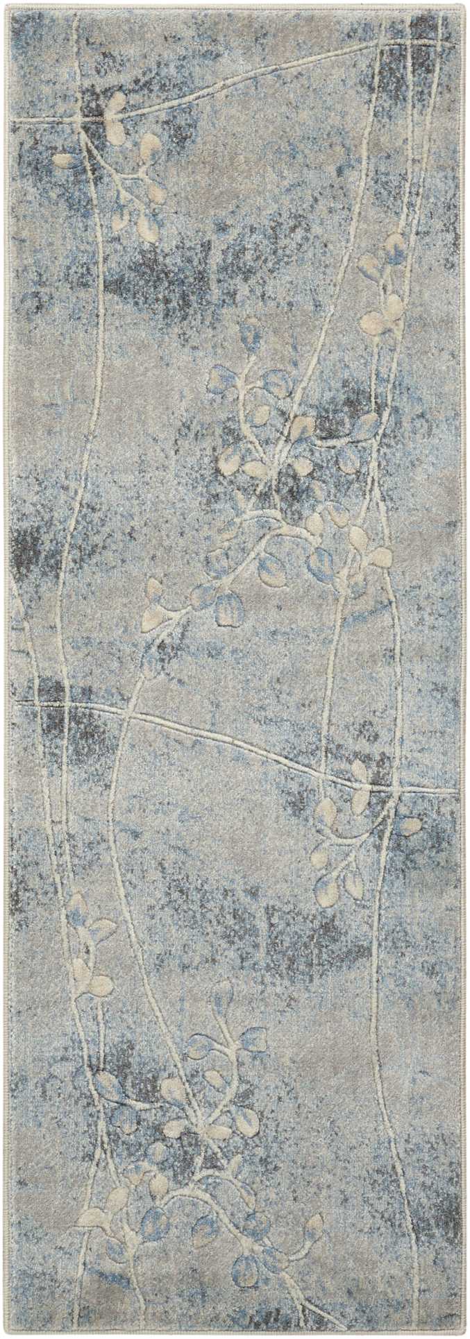 Blue-gray runner rug with pale beige vine and leaf motifs on a mottled background.