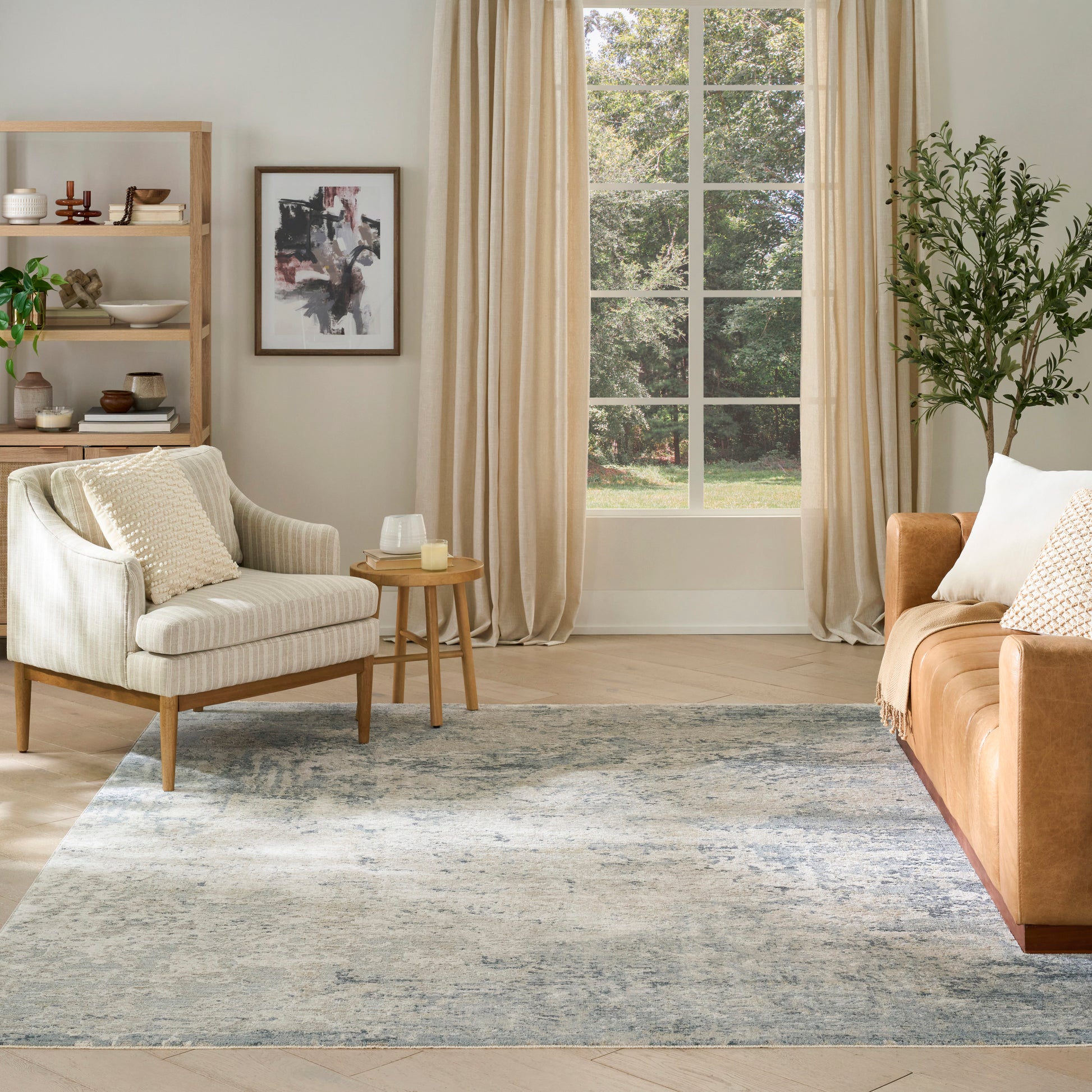 8×10 Nourison Envy Rug in blue and silver — abstract high‑low textured indoor area rug with fringe edges, ideal for living room, bedroom, and contemporary home décor.