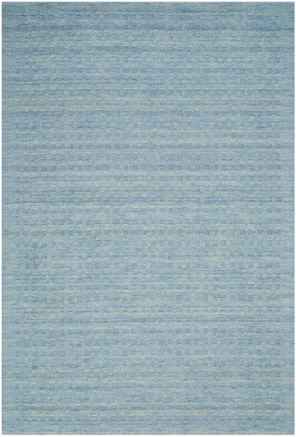 Blue-toned area rug with subtle variegated texture and soft woven stripes; versatile living room accent.