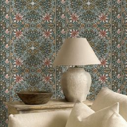 Walthamstow Wallpaper by Morris & Co. in Forest & Teal featuring an intricate Arts & Crafts pattern with stylized honeysuckles, daisies, flowing acanthus leaves, mirrored floral motifs, and a decorative checkerboard border. This digitally printed FSC-certified wide-width wallpaper from The Unfinished Works collection showcases timeless William Morris-inspired botanical design for luxury living rooms, dining rooms, bedrooms, studies, hallways, and elegant feature walls.