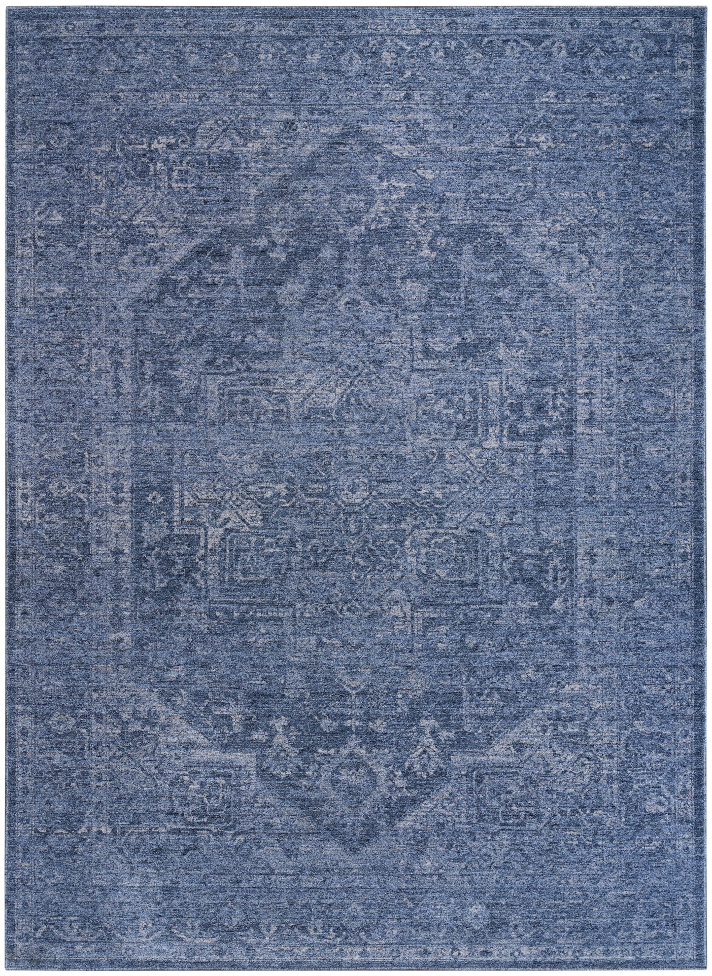Blue distressed rug with faded Persian-style medallion and ornate border; vintage floor decor.