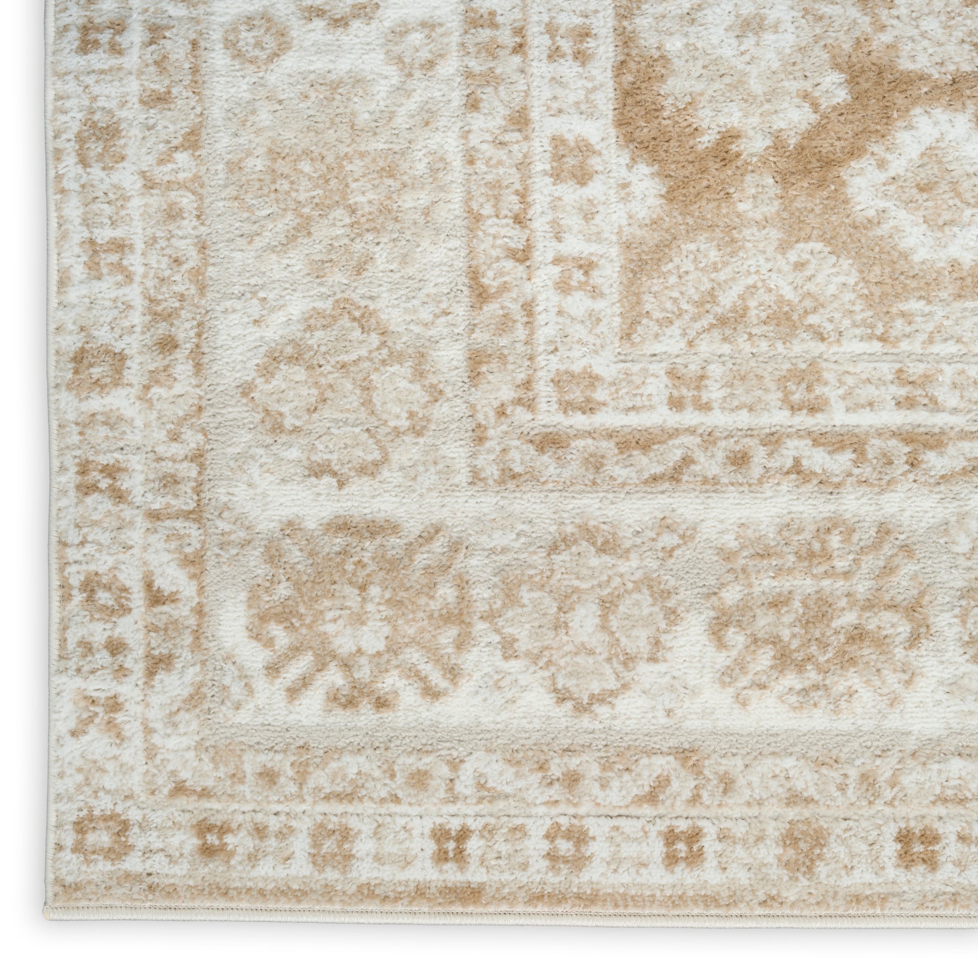 Beige cream oriental rug with muted floral medallions and decorative border, soft textured pile.