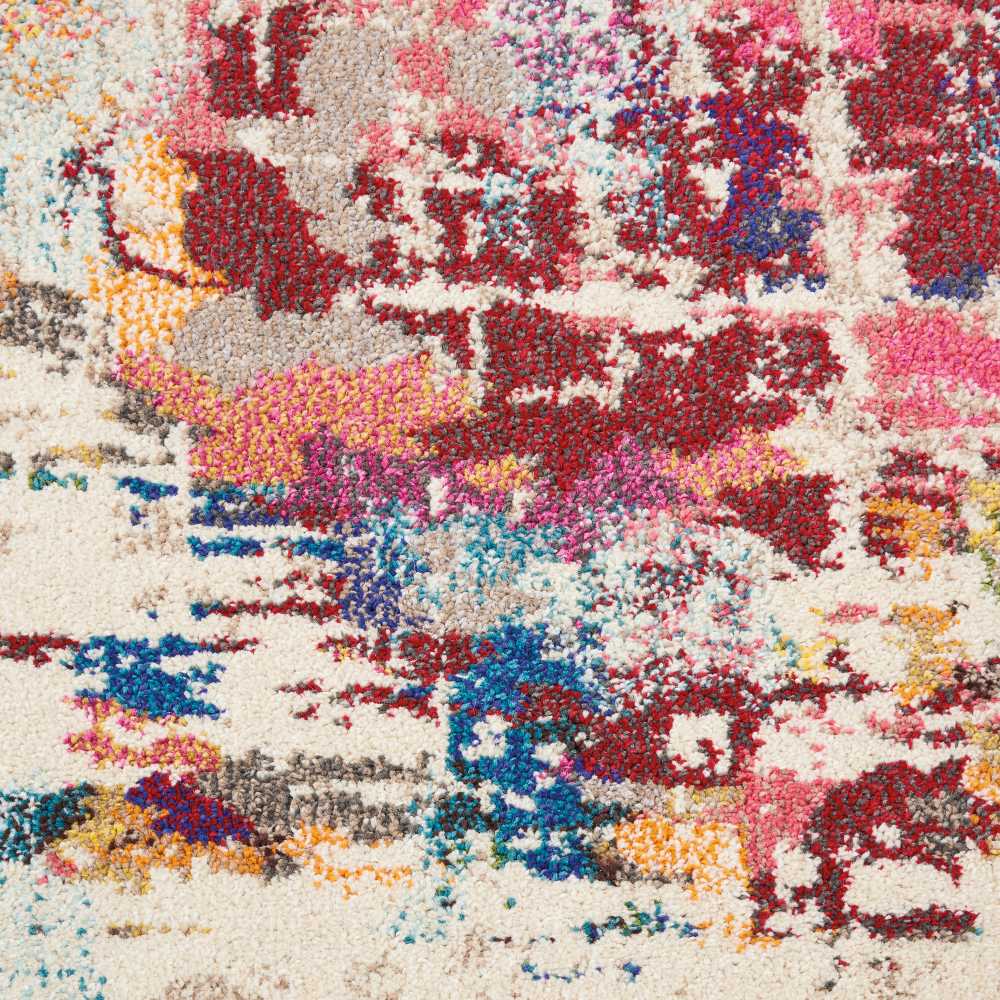 Abstract multicolor shag rug with vibrant red, pink, blue, yellow on cream base.