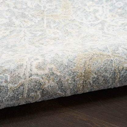 Soft light-gray and ivory damask area rug with pale blue accents; plush woven pile.