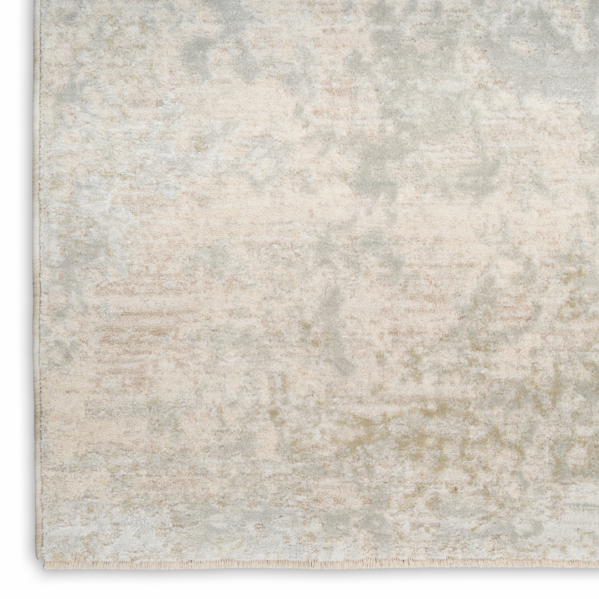 Cream distressed area rug with a subtle gray-beige pattern and short fringe along the edges; rectangular 5' x 8', modern vintage style.