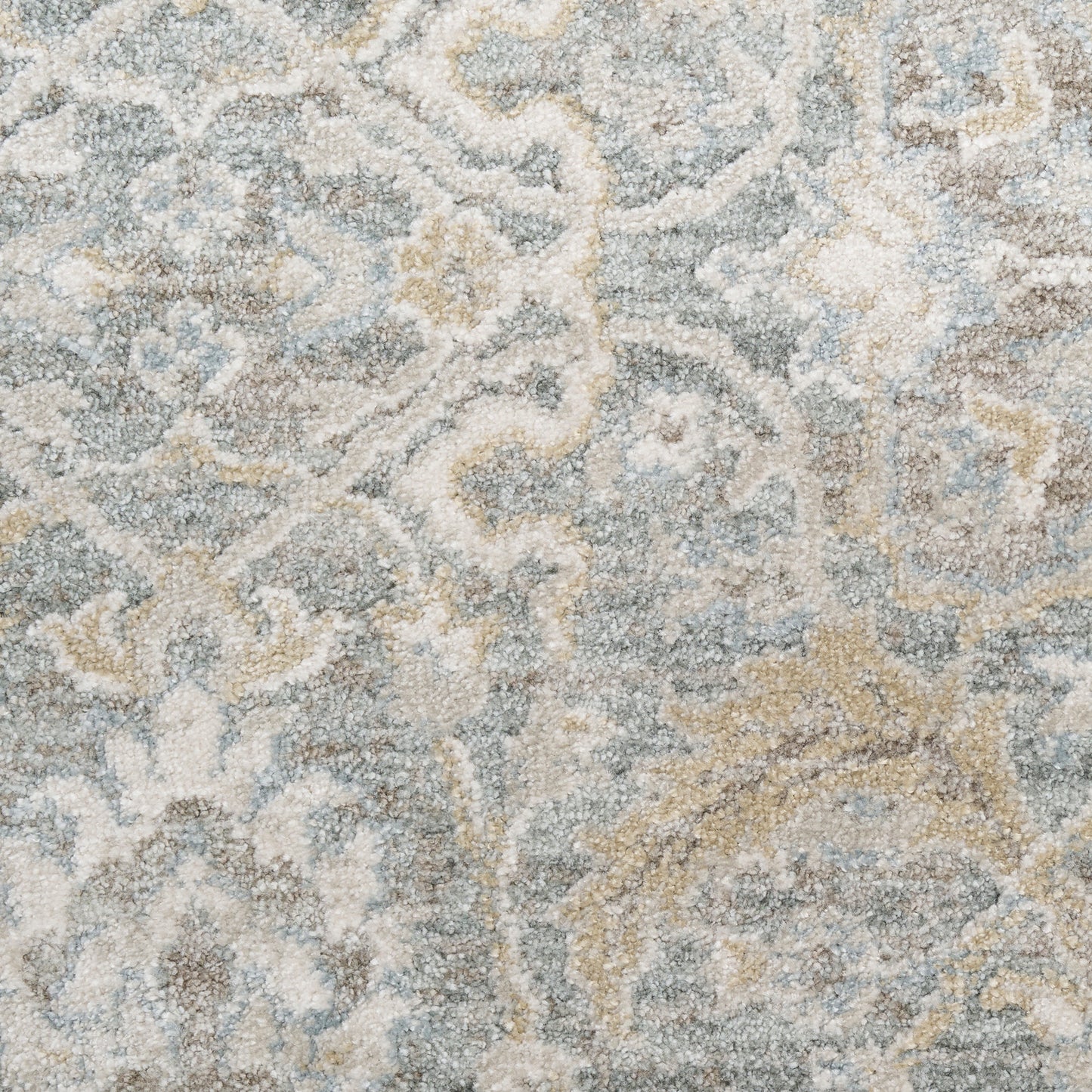 Blue-gray area rug with ivory-beige damask pattern and plush textured pile; classic, versatile decor piece.