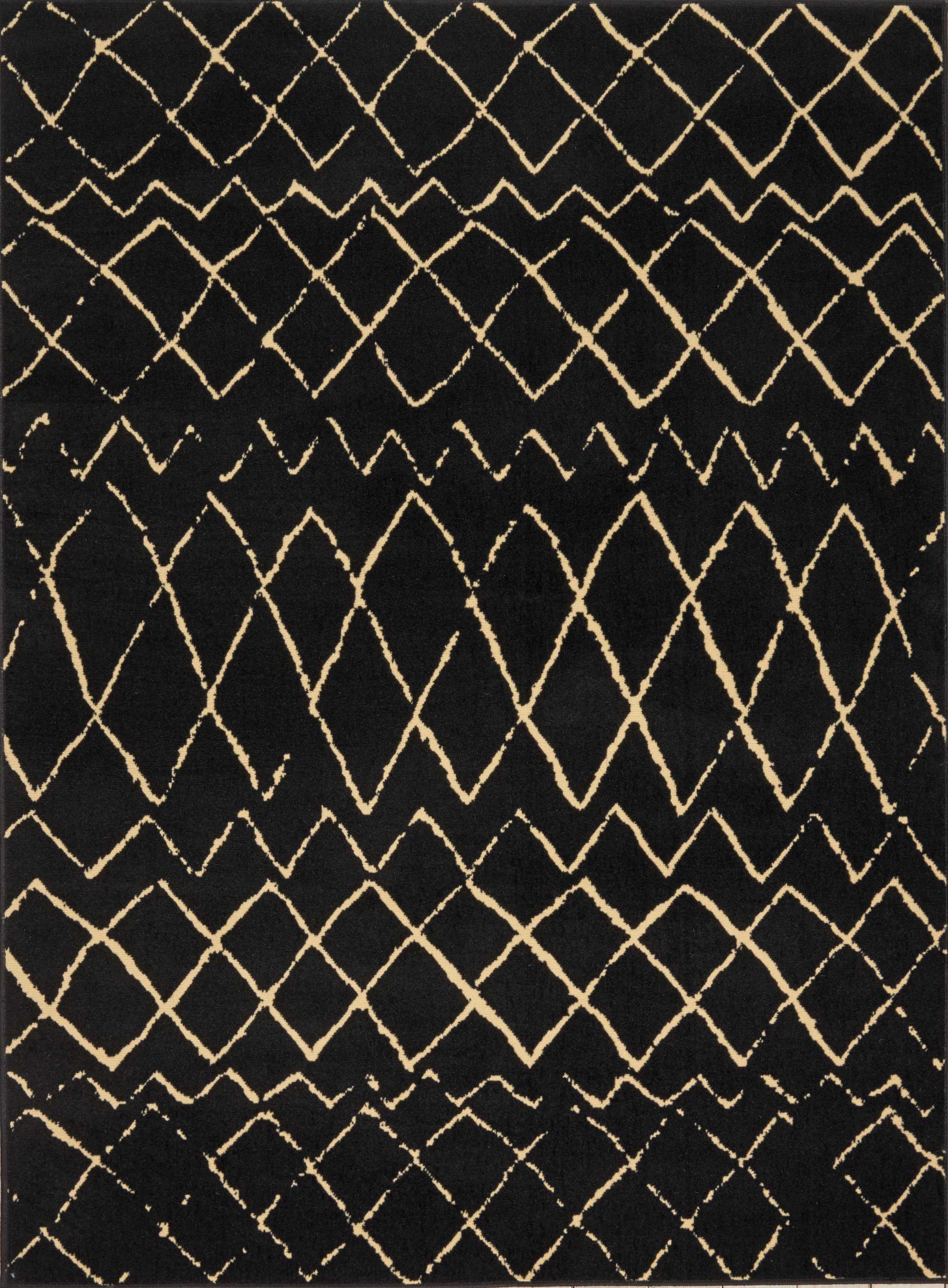 Black rug with cream diamond lattice pattern; geometric, woven boho style decorative floor covering.