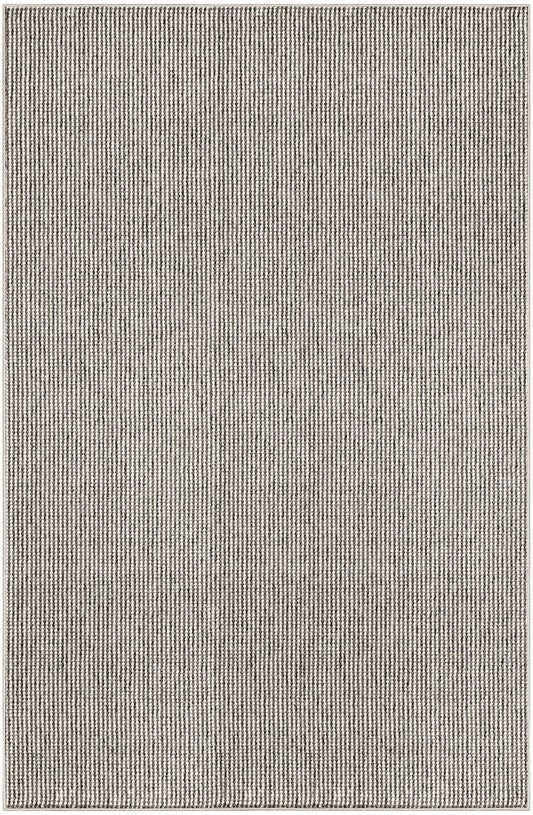 Grey woven area rug with subtle vertical stripe texture; rectangular, modern neutral decor for living room.