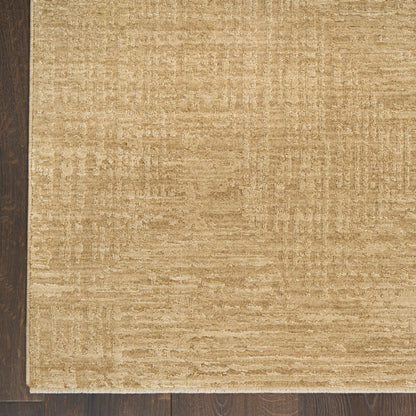 Beige rectangular area rug with subtle textured pattern on dark wood floor; neutral, modern home decor.