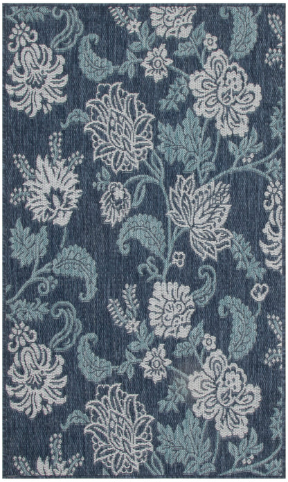 Dark blue rug with a damask floral pattern in light cream & teal and scrolling leaves, 3' x 5'.