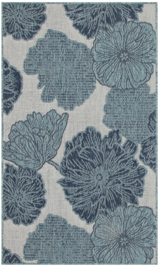 Blue-gray floral upholstery fabric with large peony-like blooms on a beige background.