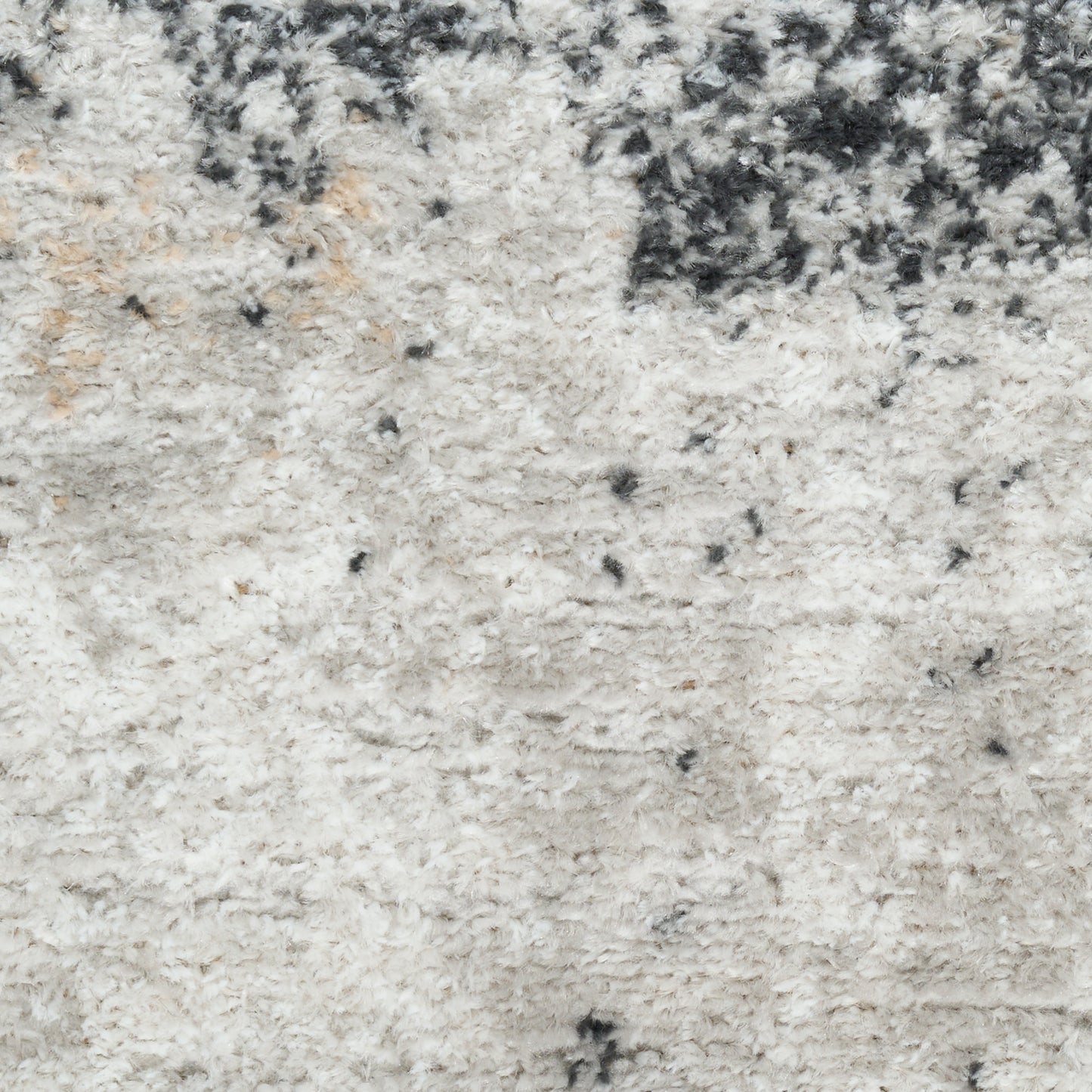 Soft ivory shag rug with cream tones and charcoal speckles, plush pile ideal for living room or bedroom decor.