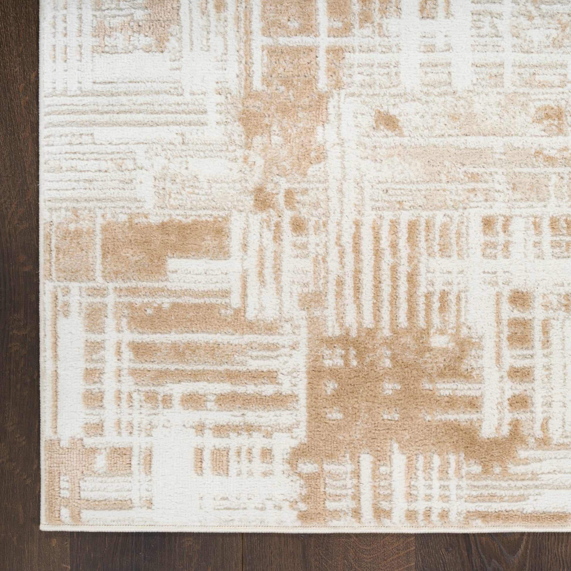 Beige & ivory geometric area rug with abstract block pattern, rectangular, modern living room decor.