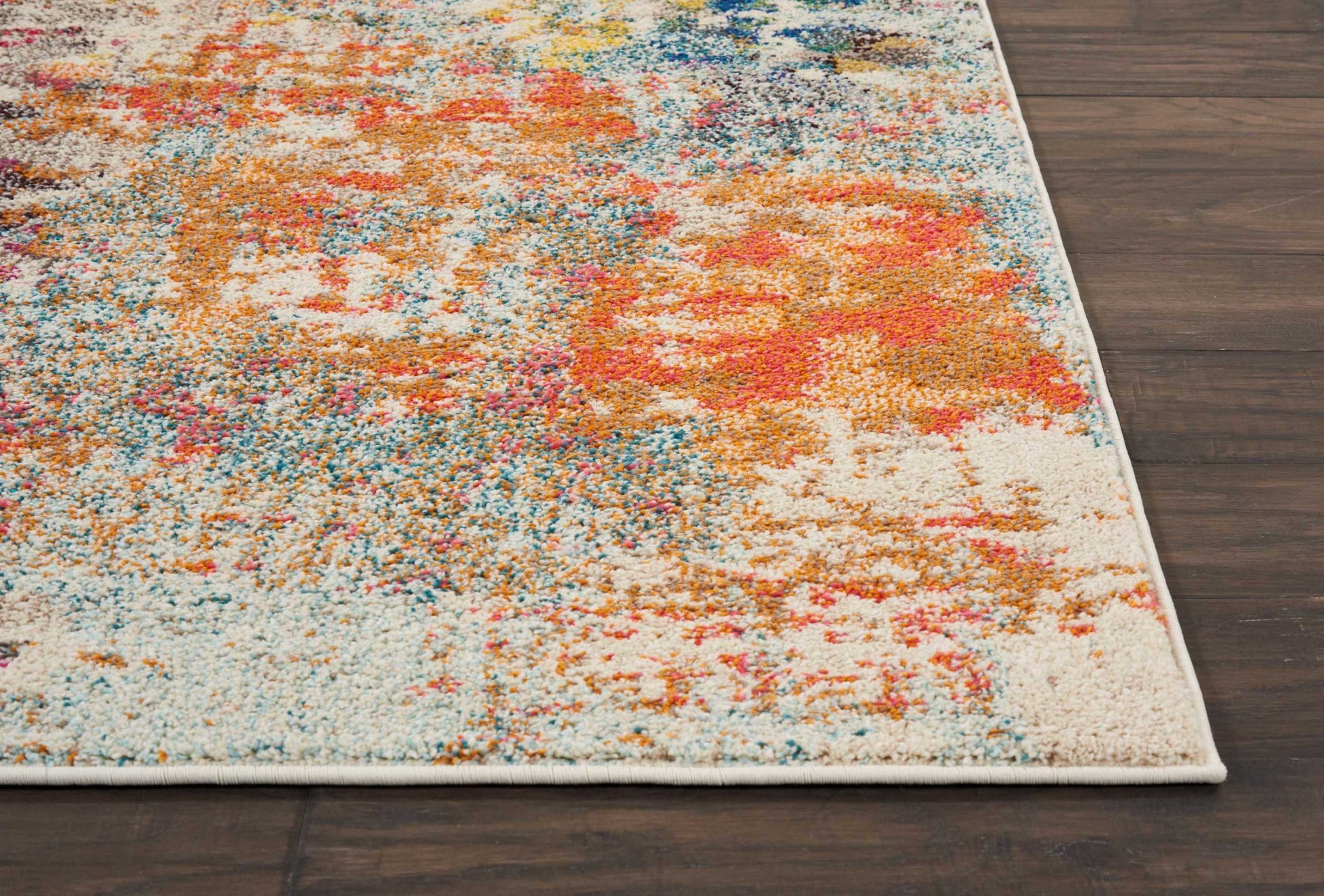 Abstract multicolor shag rug with cream base, blue, orange and pink accents; soft high-pile rectangle for living room decor.