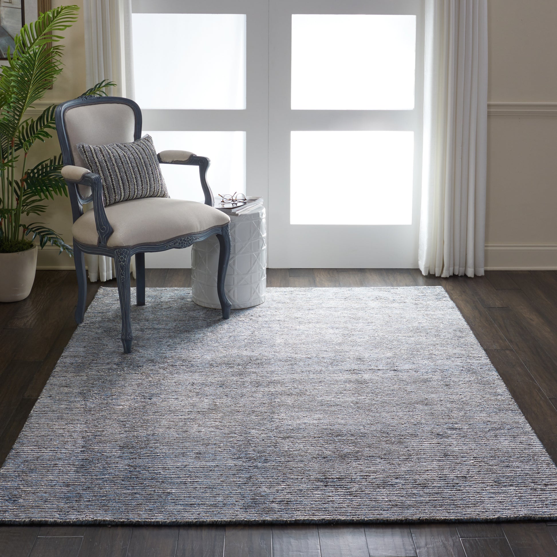 Modern 6' x 8' rug in neutral gray with blue-gray and cream tones.