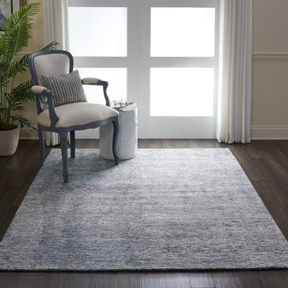 Modern 6' x 8' rug in neutral gray with blue-gray and cream tones.