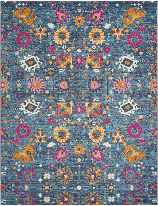Vibrant teal rug with ornate oriental floral motifs in orange, pink, yellow and purple.