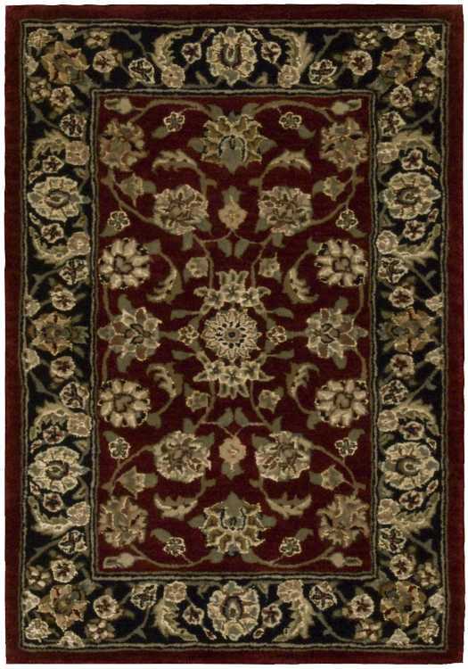 Rectangular Persian-style rug: burgundy field with ivory floral medallions and scrolling vines, bordered by a dark border with beige floral motifs.