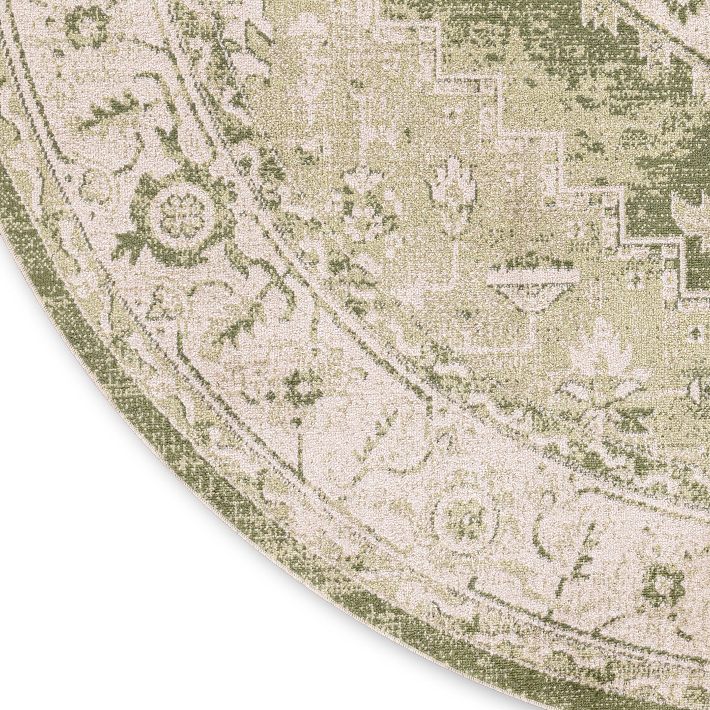 Round area rug with antique-style botanical pattern in muted green and cream.
