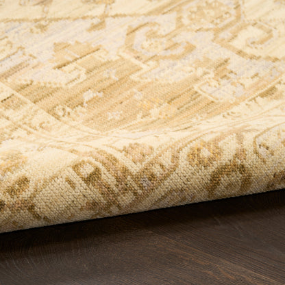 Beige oriental rug with cream and light brown geometric floral pattern, rolled edge on dark wood floor.