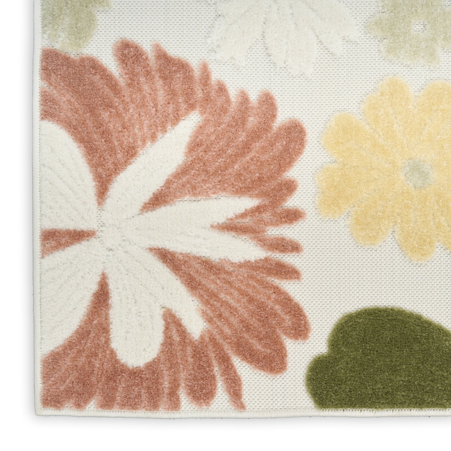 Soft floral-pattern rug corner with oversized pink flower, white center, yellow bloom, and green leaf on cream background