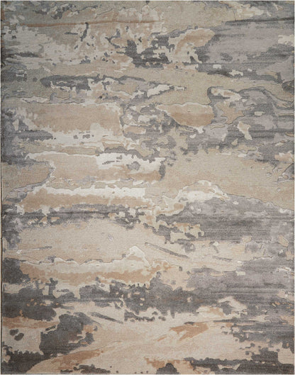Abstract distressed area rug in beige, taupe and gray with irregular mottled patches.