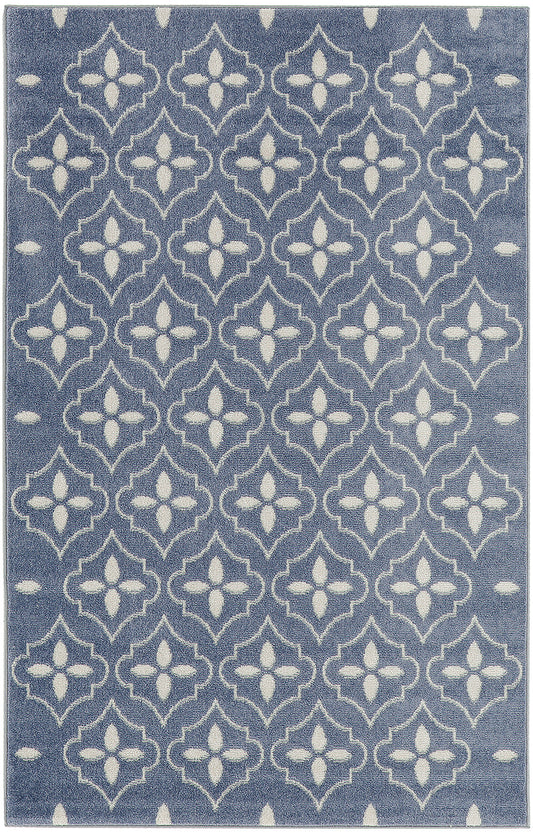 Blue area rug with white Moroccan quatrefoil lattice pattern; modern decorative floor covering.