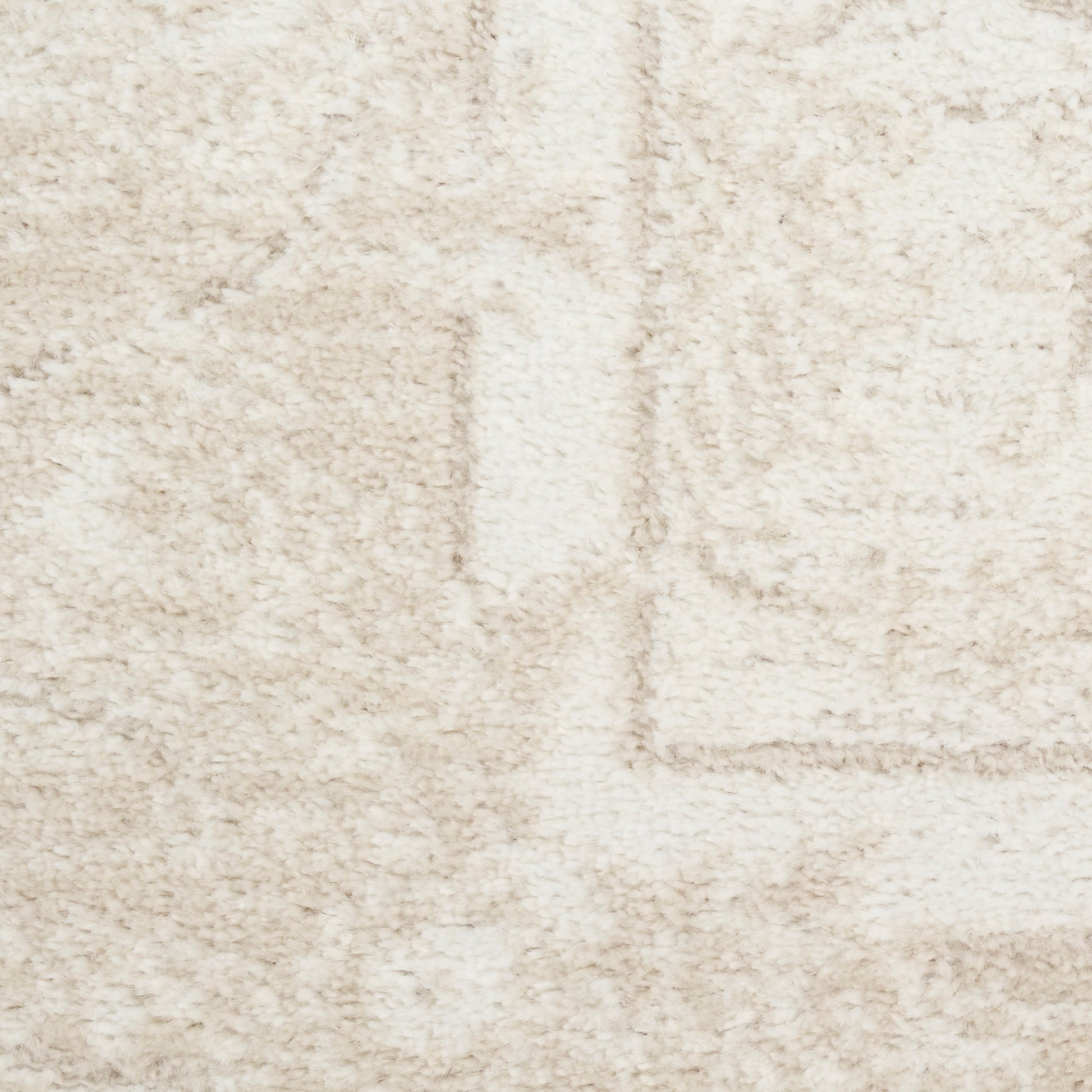 Beige textured area rug with cream tones and a subtle geometric panel pattern; plush, shaggy pile.