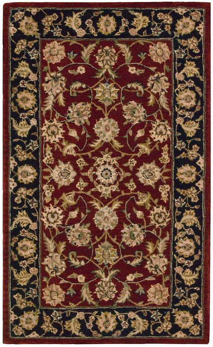 Rectangular Persian-style rug with burgundy field and ivory floral motifs, and a dark navy border with scrolling blossoms.