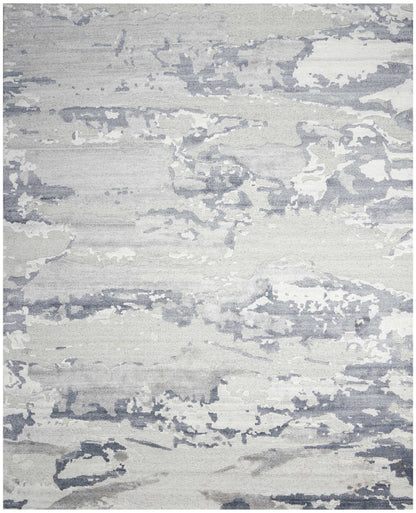 Abstract gray and white distressed rug with a soft marbled pattern, contemporary living room floor decor.